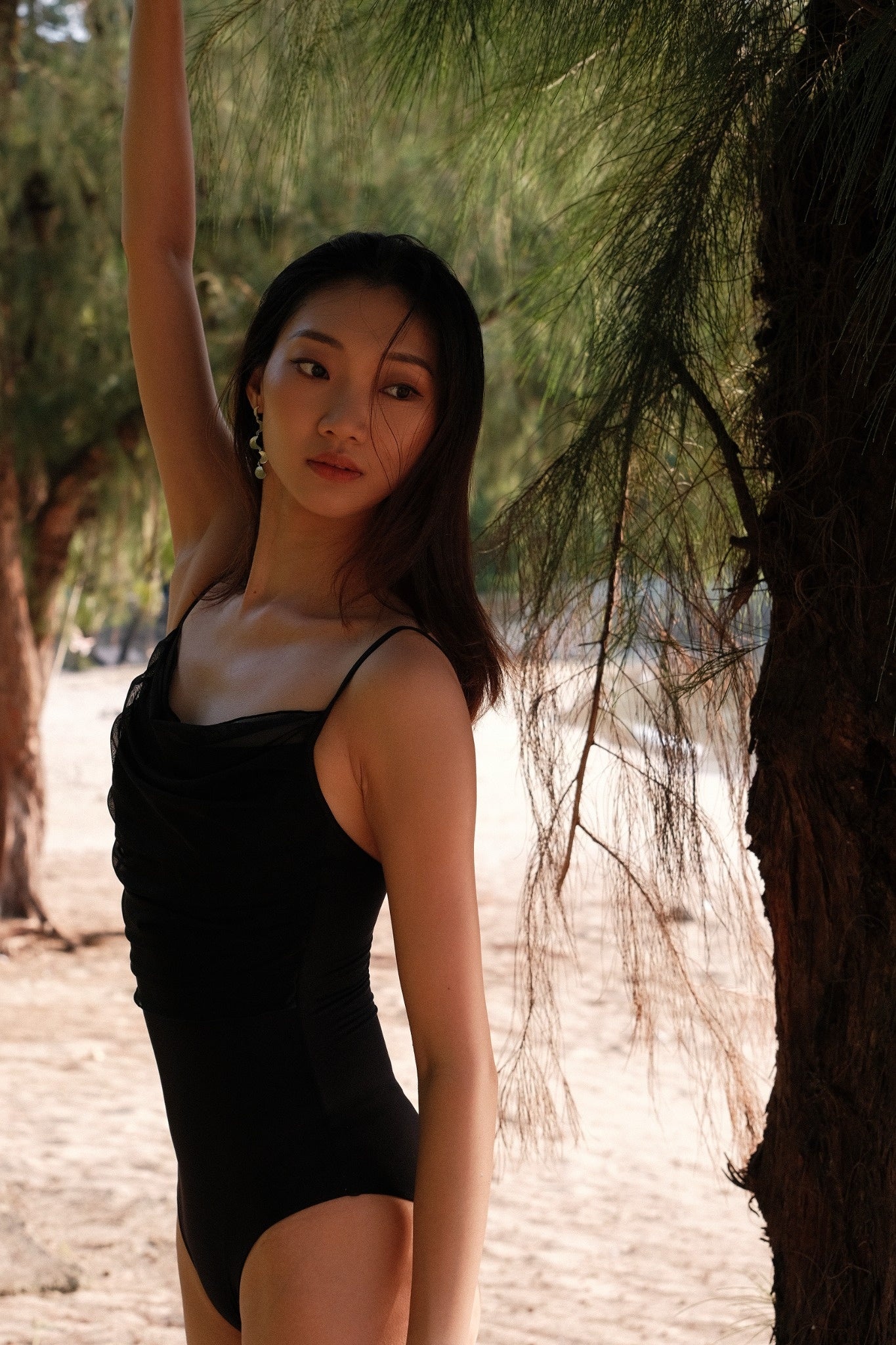 Ballet dancer wears No.6 Mesh Draped Camisole Leotard - moon edition in mysterious midnight black color and made with ultra-soft fabrics.