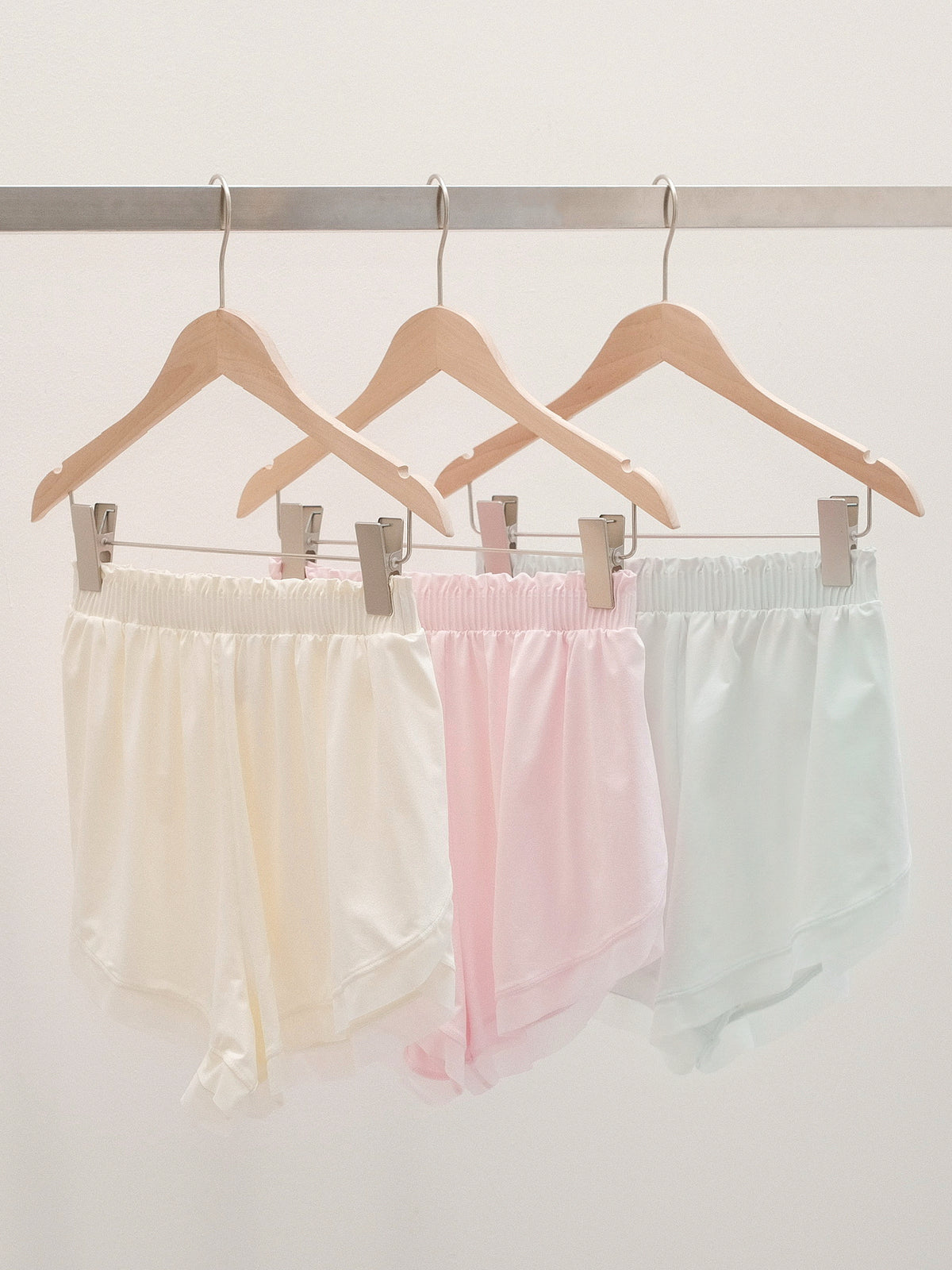 Bloom Overlap Dance Shorts product photo showing colors available in dawn white, dewy pink, and misty jade