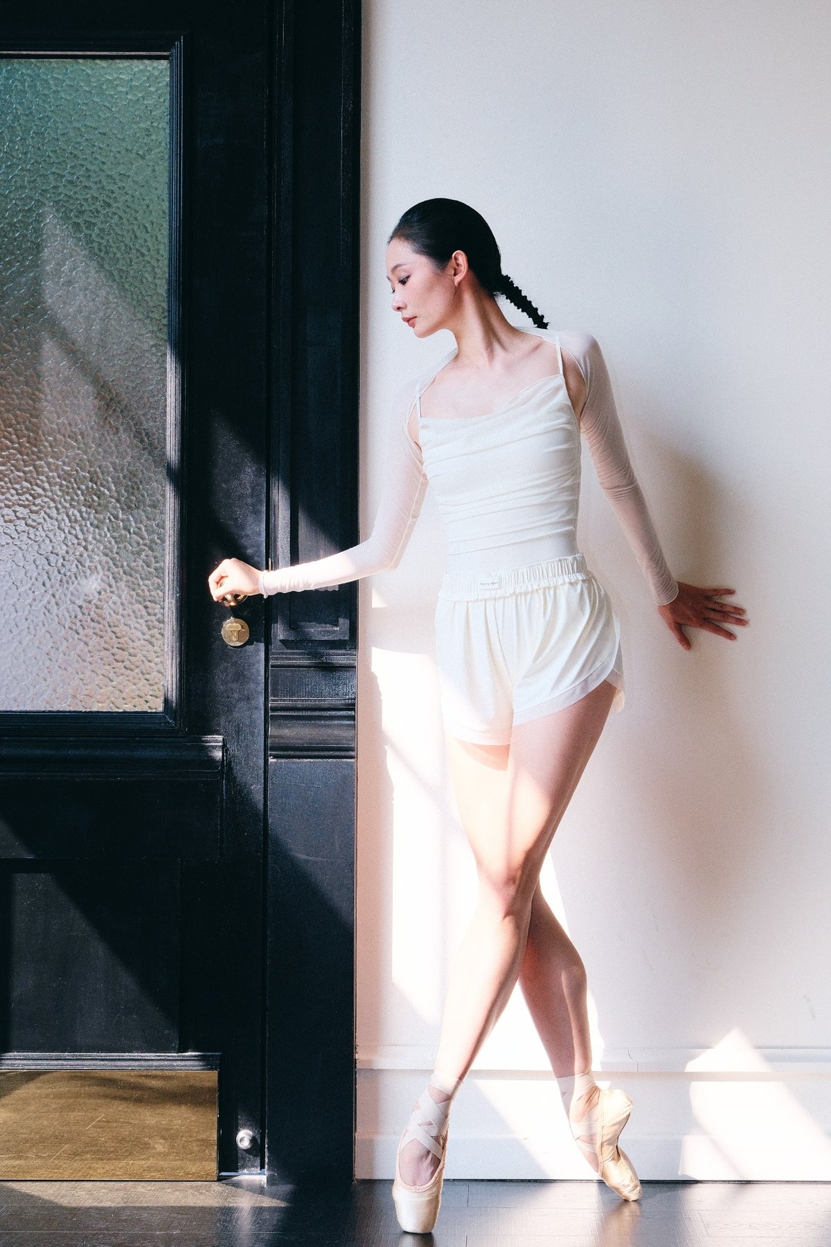 Ballet dancer on pointe in dawn white Bloom Overlap Dance Shorts 