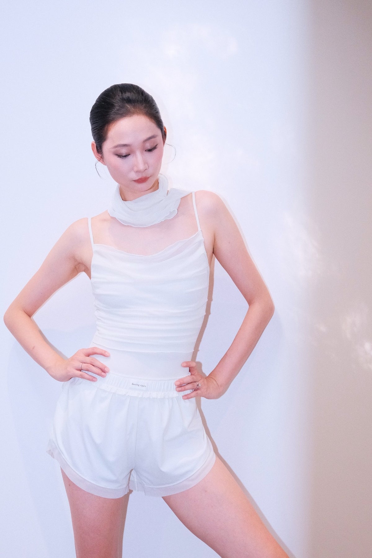 Bloom Overlap Dance Shorts in dawn white with waistband rolled to sit lower on the hip