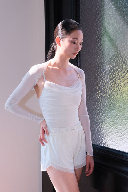Bloom Overlap Dance Shorts in dawn white paired with matching white leotard and shrug for a classy, clean and elegant ballet look
