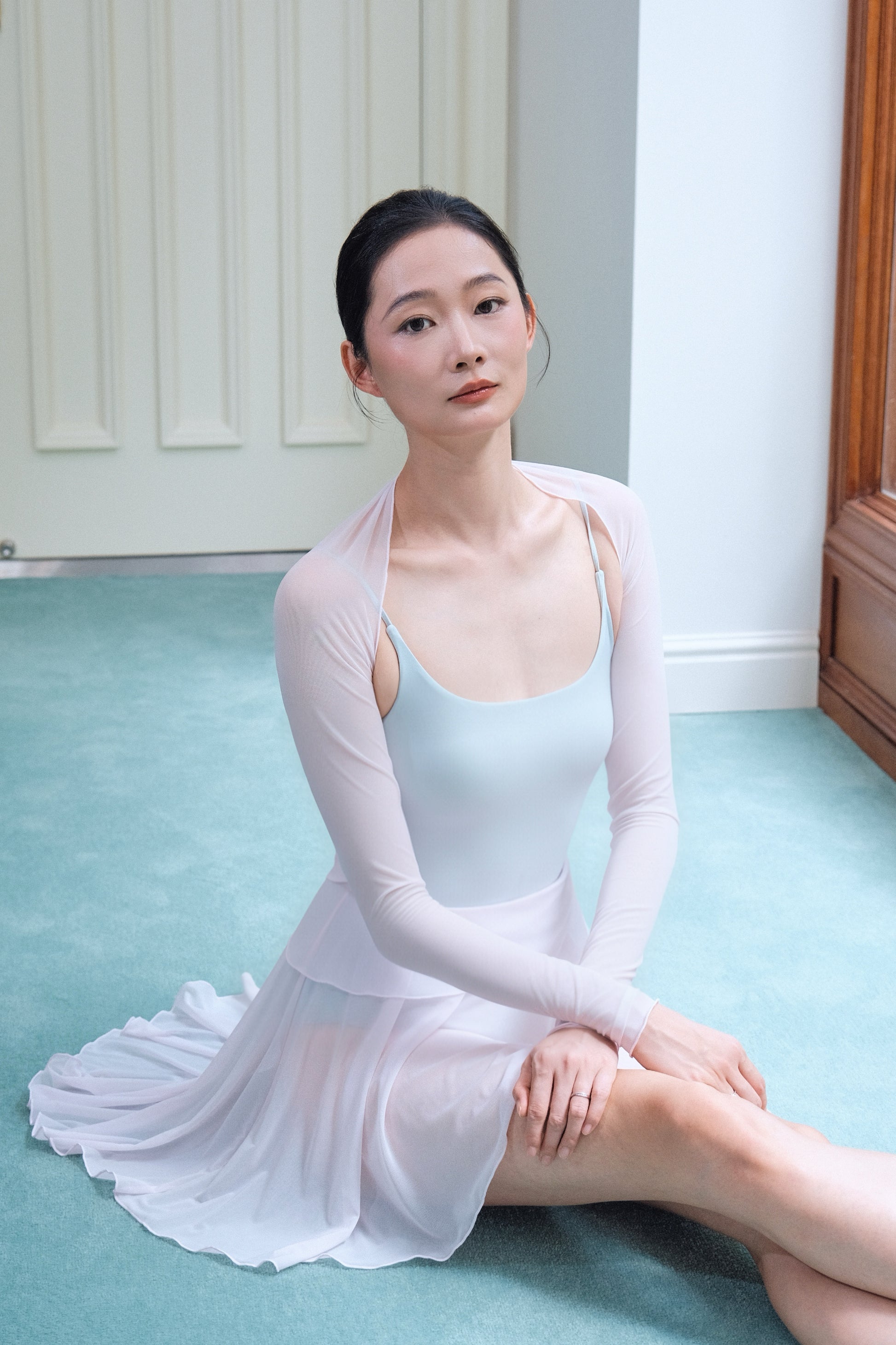 Dawn Pink Ultra-Stretch Ballet Mesh Shrug features full-length long sleeves that elegantly refine the line of the arms.