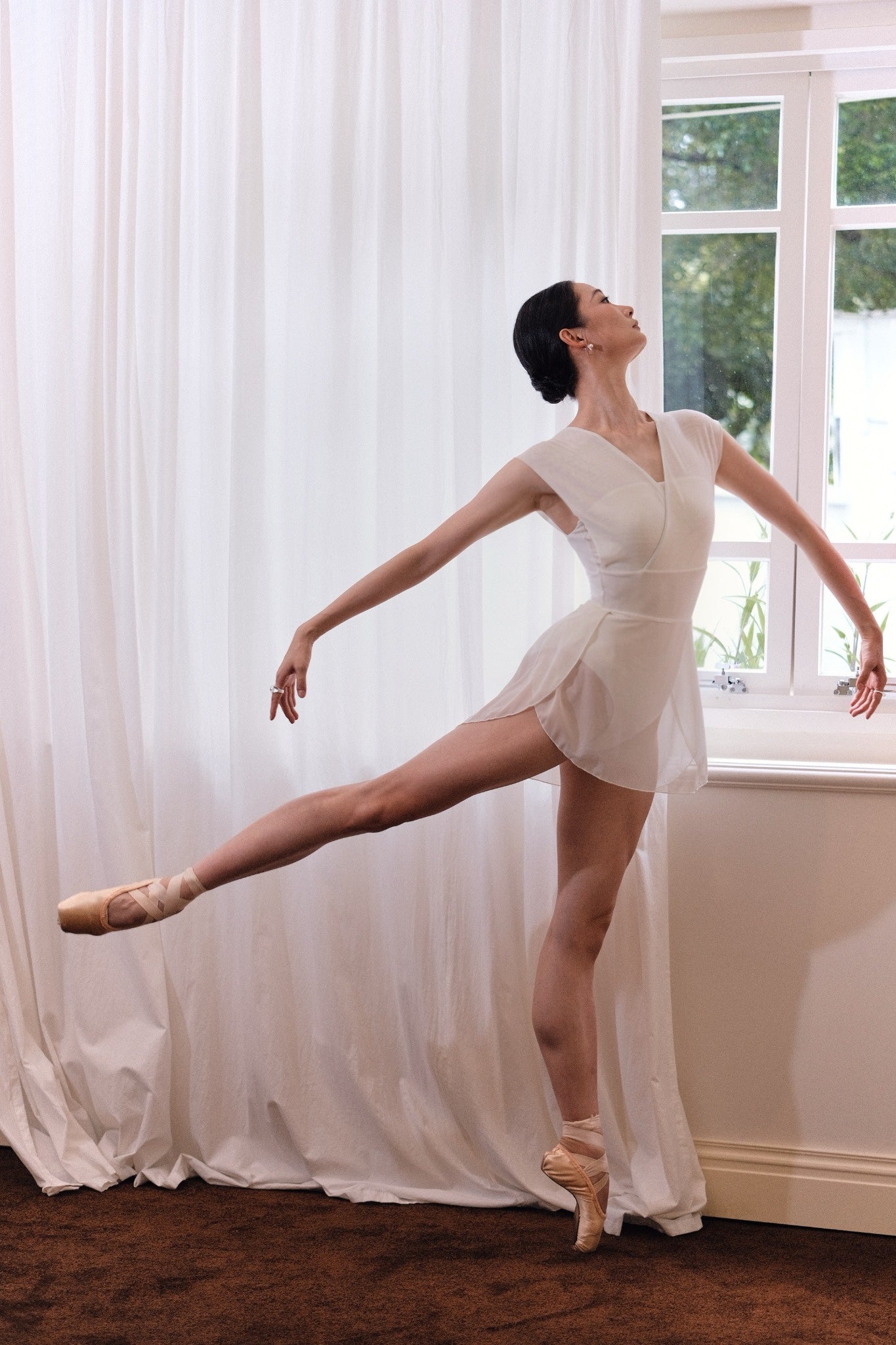 Dawn White Melt Mesh Ballet Skirt in warm dawn white color, offering versatile styling options 