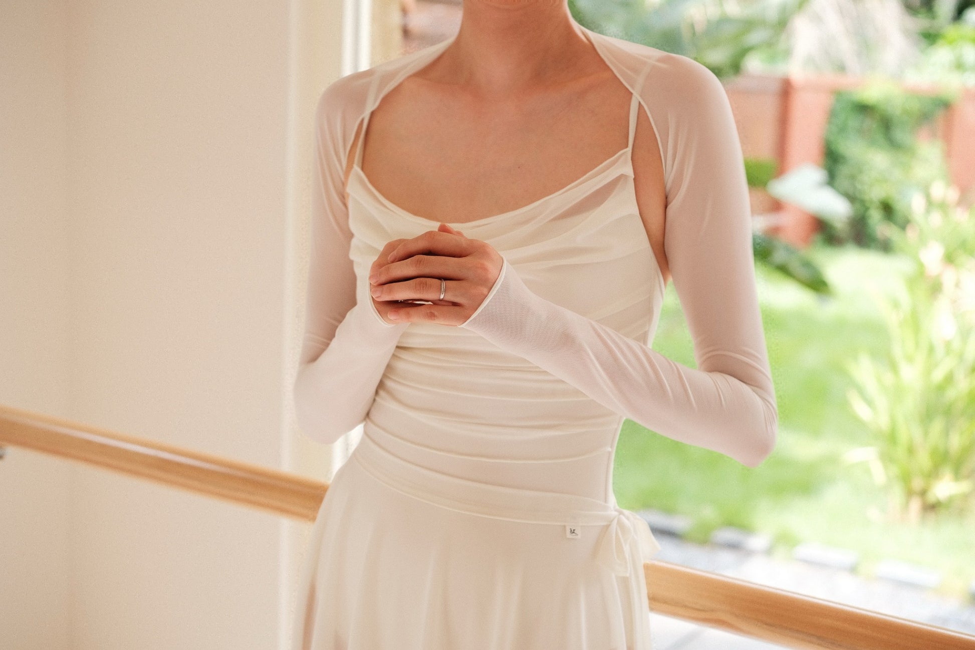 Dawn White Ultra-Stretch Ballet Mesh Shrug provides ultra-soft coverage to the arm and neck of the dancers