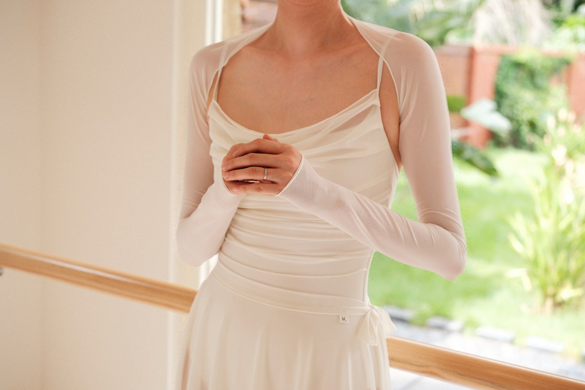 Dawn White Ultra-Stretch Ballet Mesh Shrug provides ultra-soft coverage to the arm and neck of the dancers