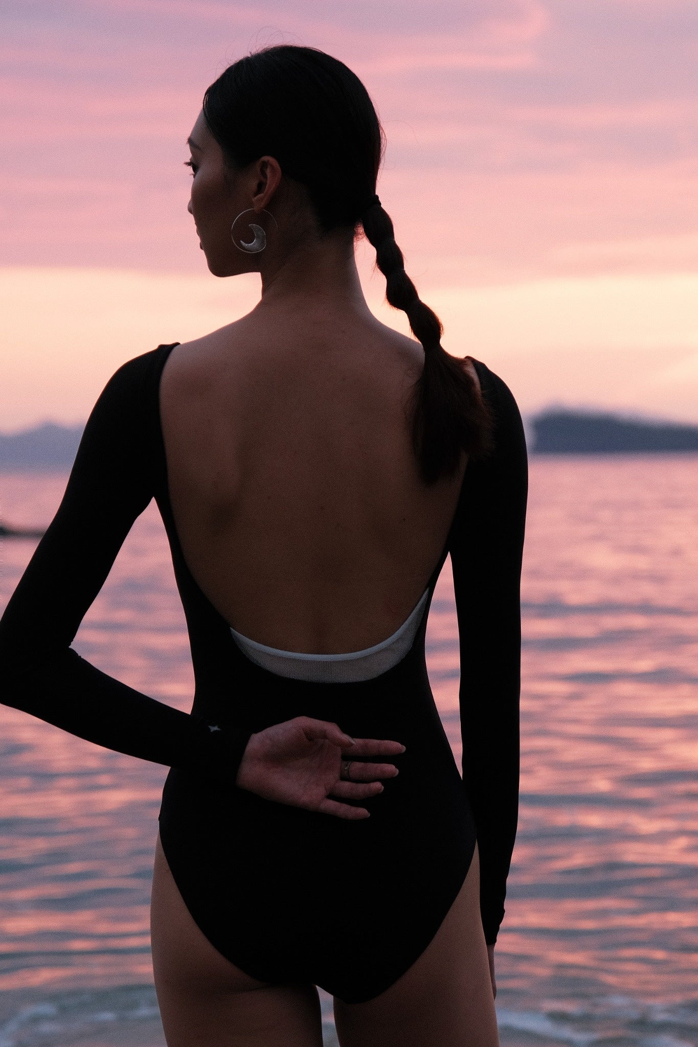 New Moon Wide Boatneck Long Sleeve Leotard features subtle yet striking embellishments: a “new moon” detail at the lower back