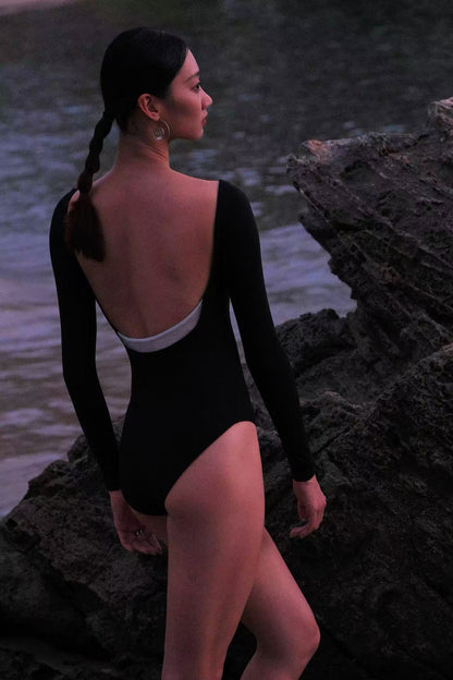 The New Moon Wide Boatneck Long Sleeve Leotard features a open back which creates a clean, timeless silhouette that evokes the quiet elegance of the night sky