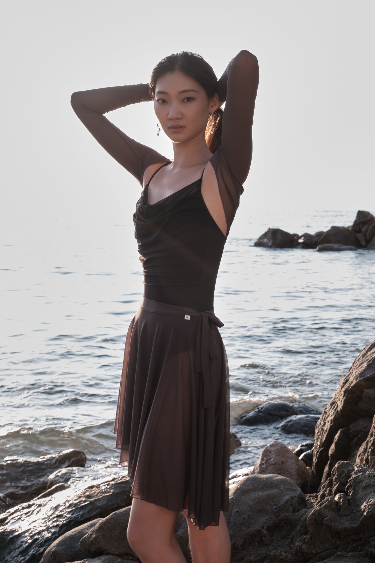 Ballet dancer in 「No.6」Mesh Draped Camisole Leotard - Moon Edition, pairing it with the autumn haze midi ballet skirt for an elegant and timeless look