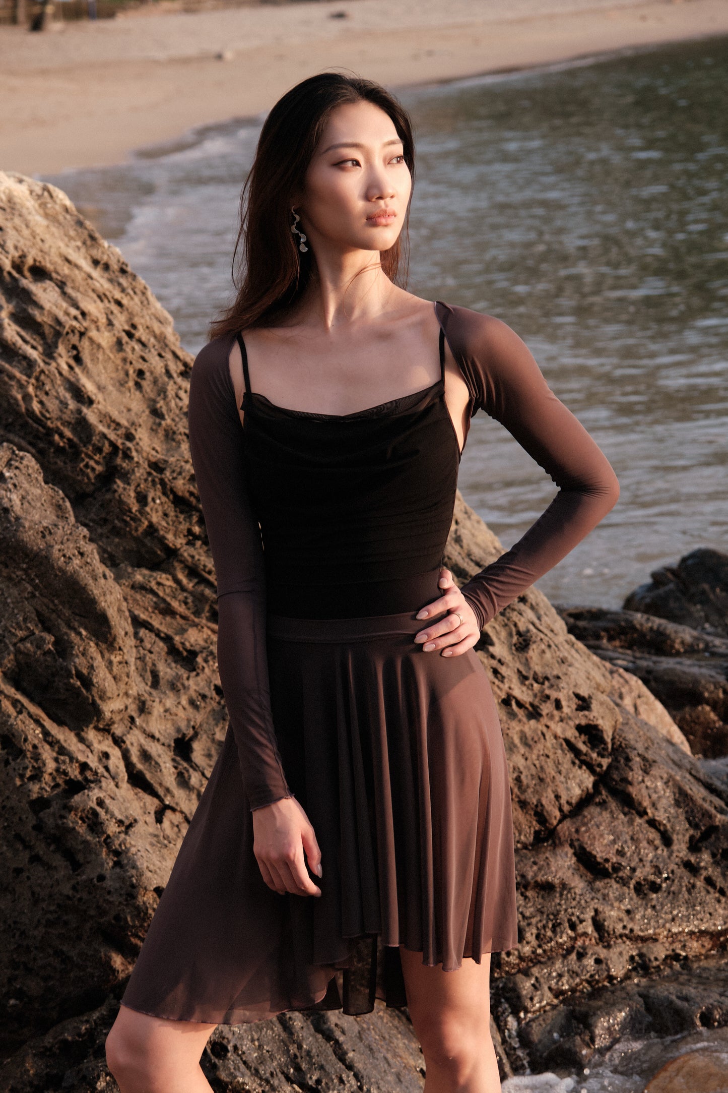 Ballet dancer wears 「No.6」Mesh Draped Camisole Leotard - Moon Edition, a leotard that features a sheer stretch mesh at chest for a soft and chic ballet look