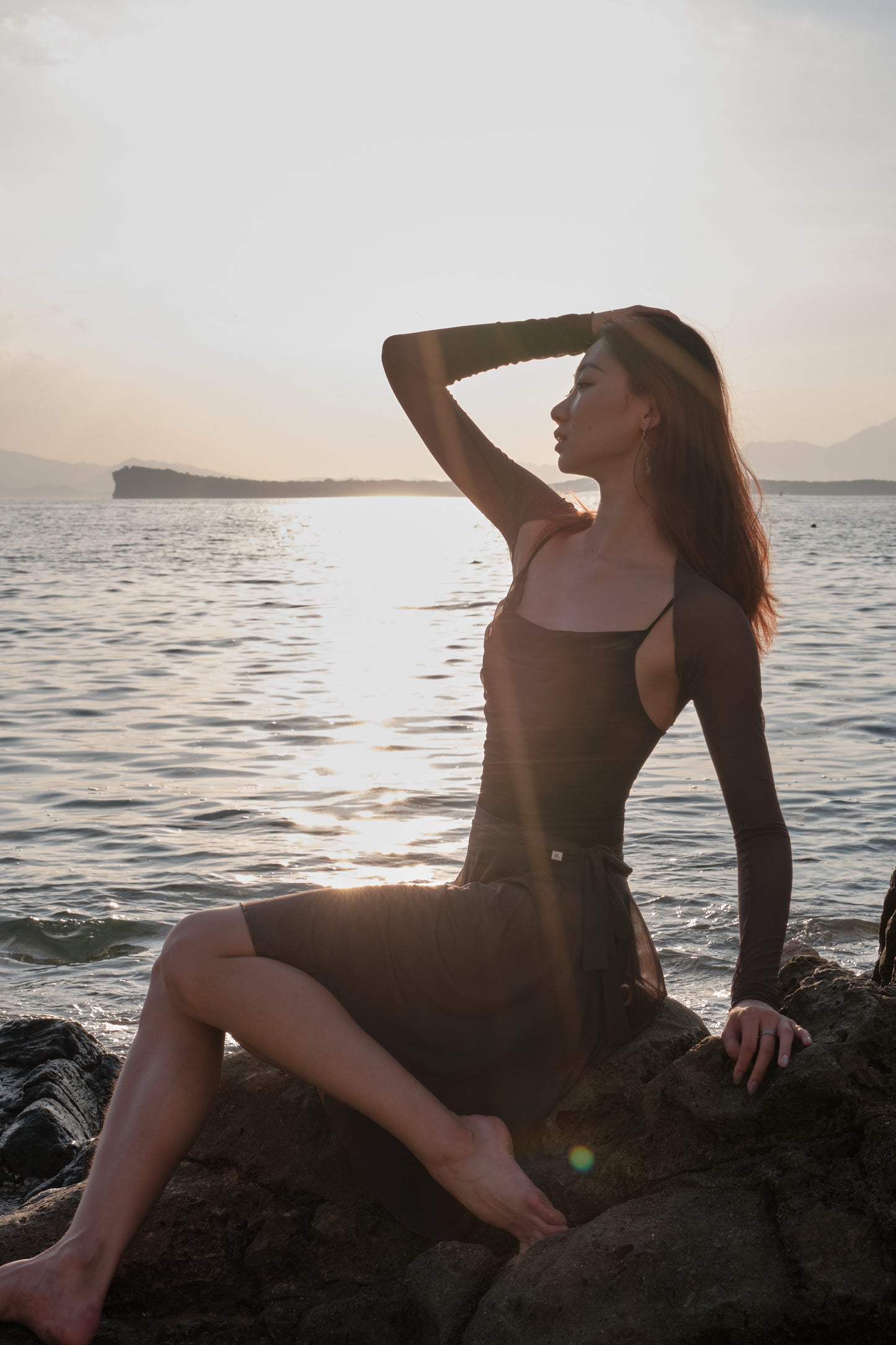 Ballet dancer in No.6 Mesh Draped Camisole Leotard - moon edition, pairing it with ultra-soft shrug for an feminine ballet look