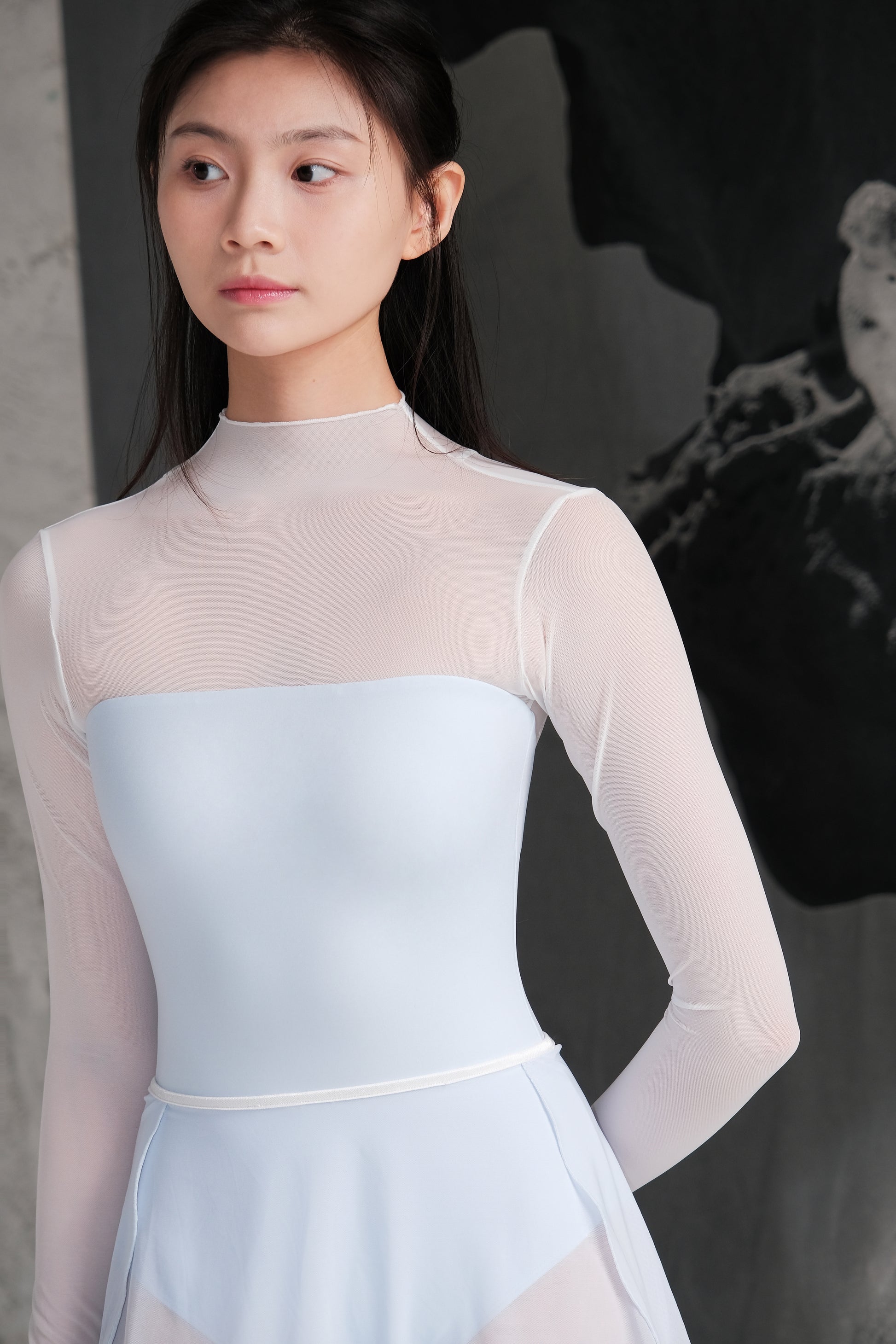 「No.9」Mock Neck Mesh Long Sleeve Leotard is made with LYCRA® ADAPTIV for a sculpted, ultra-soft feel.