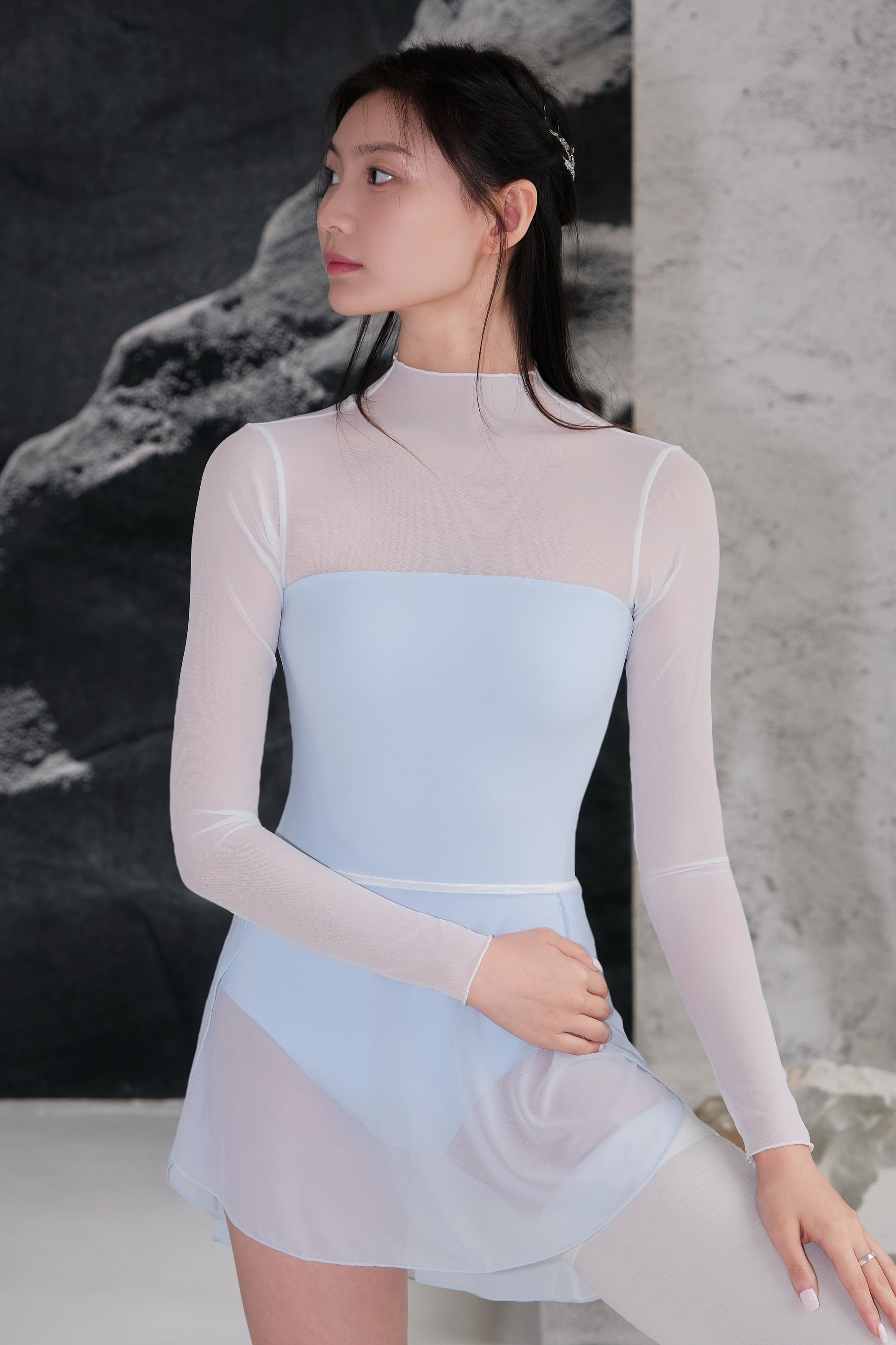 「No.9」Mock Neck Mesh Long Sleeve Leotard features soft, flowing lines that contour the body