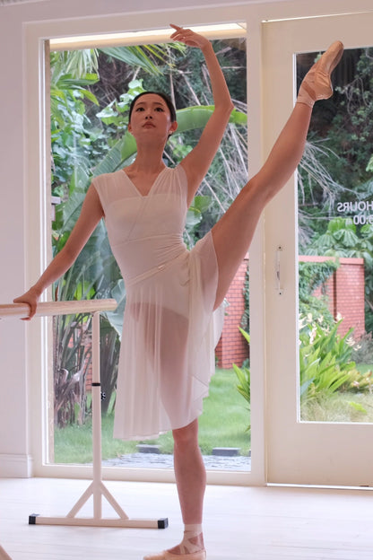 Dancer in dawn white Pull-On Full-Circle Ballet Rehearsal Skirt doing a la seconde