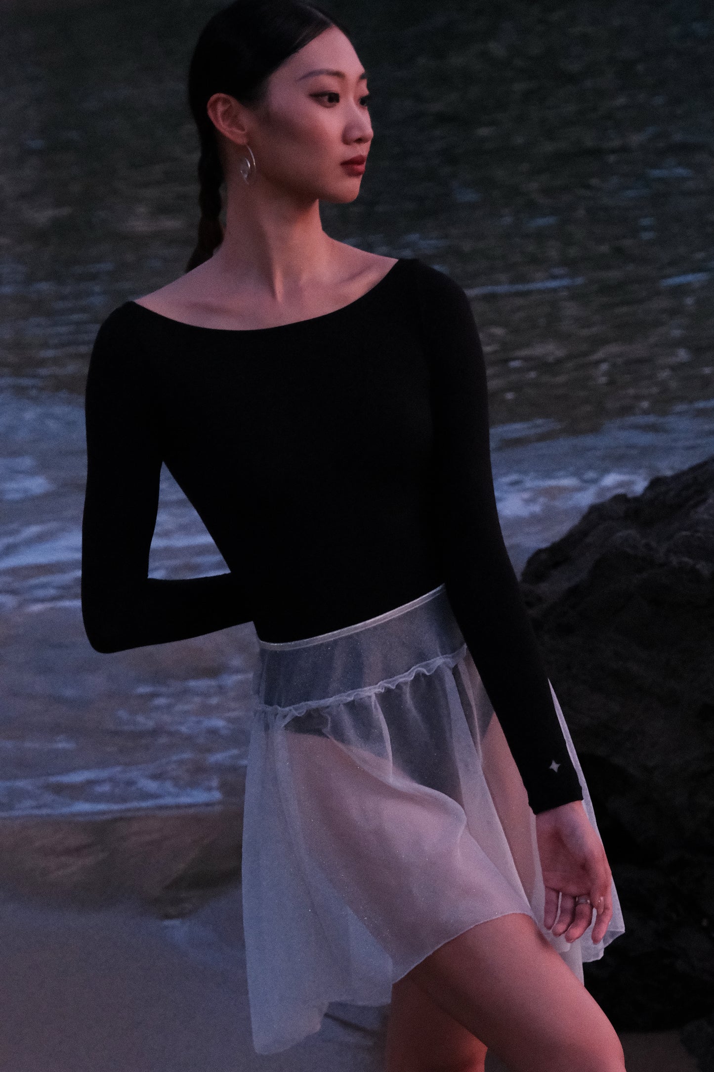 The New Moon Wide Boatneck Long Sleeve Leotard in black offers versatile styling options 