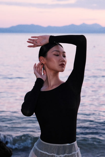 The New Moon Wide Boatneck Long Sleeve Leotard is crafted to accompany dancers through every rehearsal, offering both sophistication and inspiration.