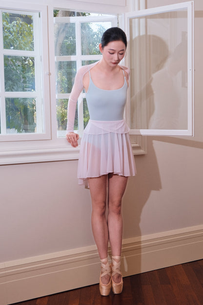 Twin-petal midi Skirt in soft pink with petal-shaped panels of the wrap skirt draping softly at the waist 