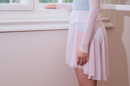 Twin-petal Skirt features short in front and long in back hem which flows with movements