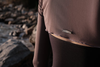 Ultra-Stretch Ballet Mesh Shrug features a hand-sewn logo tag of imported natural Black Mother-of-Pearl in the back for a refined detail